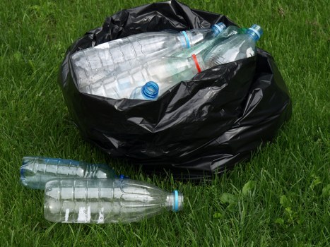 Recycling bins arranged for different materials in Colindale